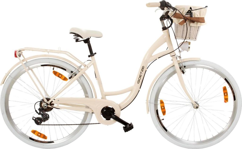 A cream-colored city bike with a basket on the front, shown against a white background.