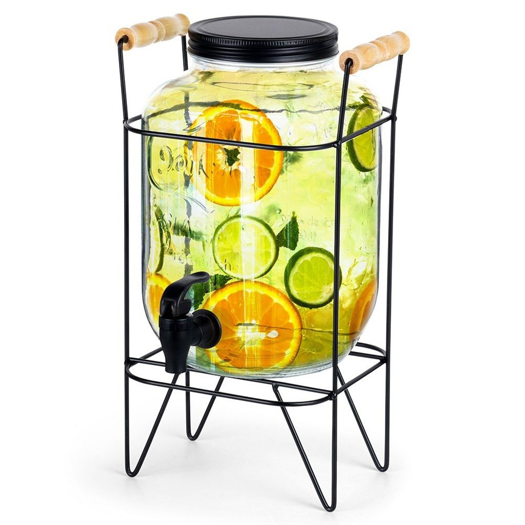 A glass beverage dispenser with a spigot and a metal stand, filled with water and fruit slices.