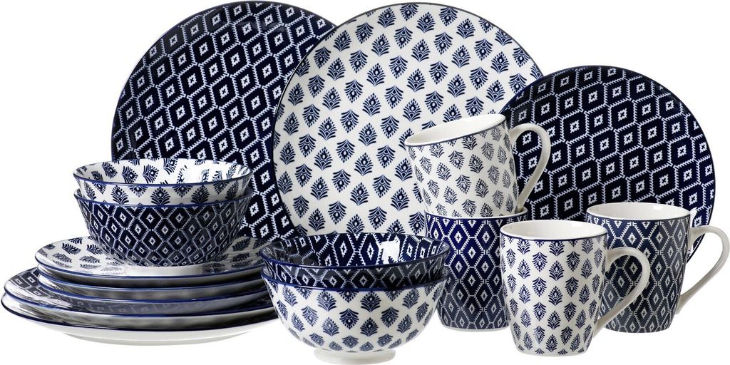 A collection of dinnerware with a blue and white geometric pattern.
