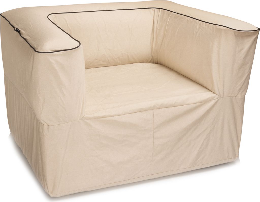 A beige lounge sofa with black trim.