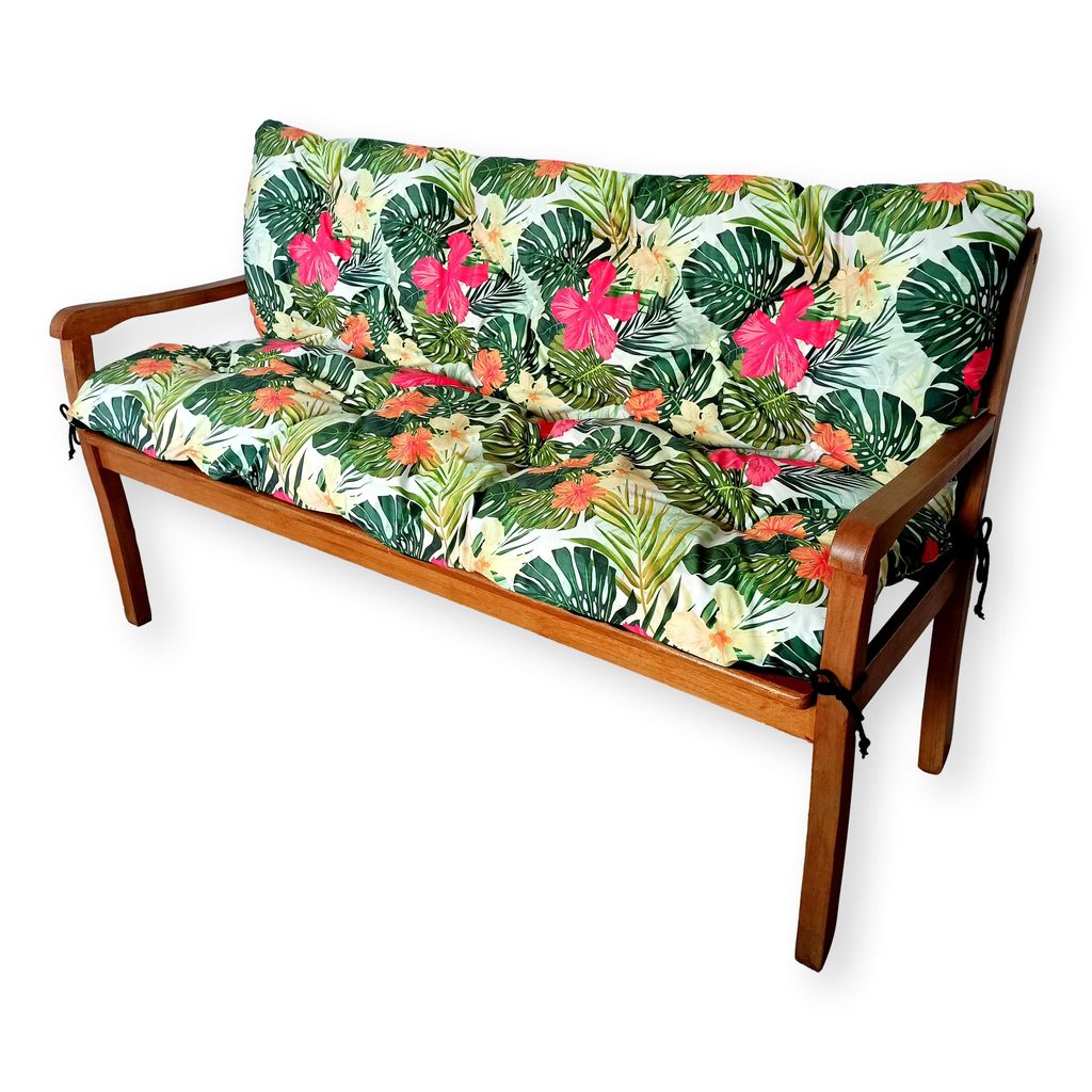 A wooden garden bench with floral patterned cushions.