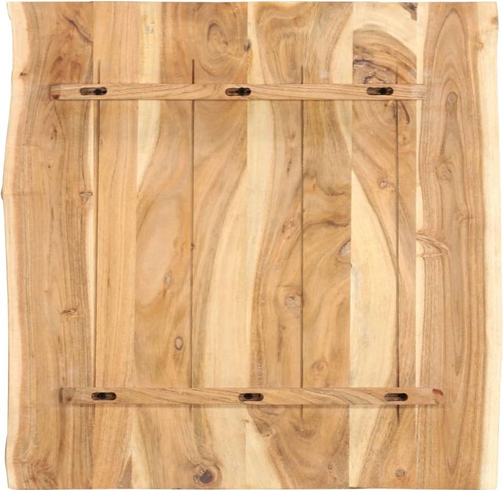 The back of a wooden table top with support beams.