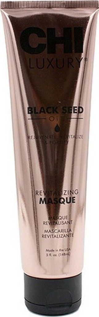 A rose gold colored tube of CHI Luxury Black Seed Oil Revitalizing Masque.