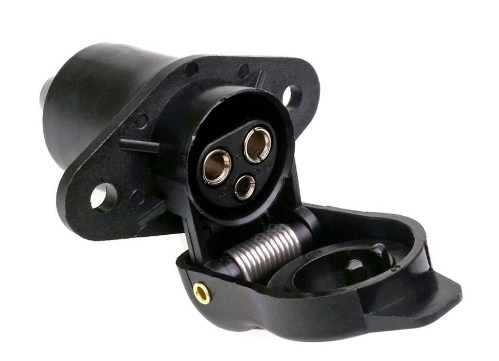 A black 3-pin trailer socket with its cover open, showing the connection points. The socket is mounted on a flange with screw holes.