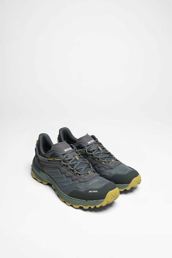 A pair of hiking shoes on a white background.