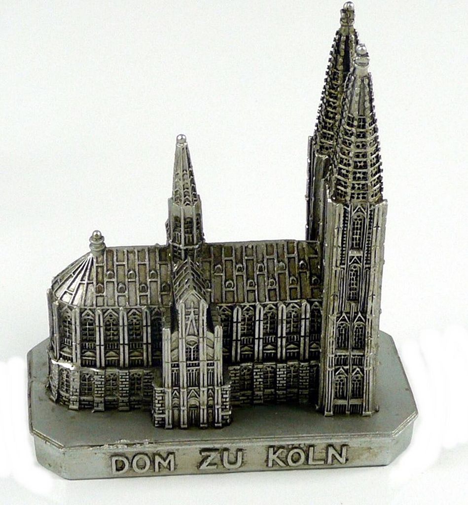 A miniature model of a cathedral on a white background.