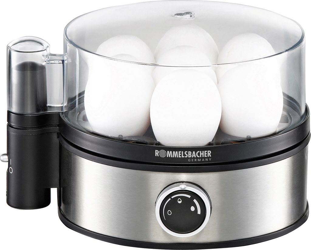 A close-up view of an electric egg cooker filled with white eggs.