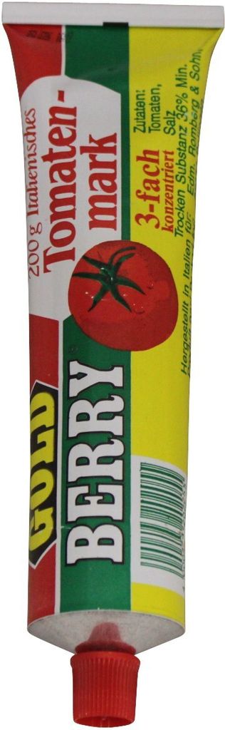 A tube of tomato paste with branding and ingredient information.