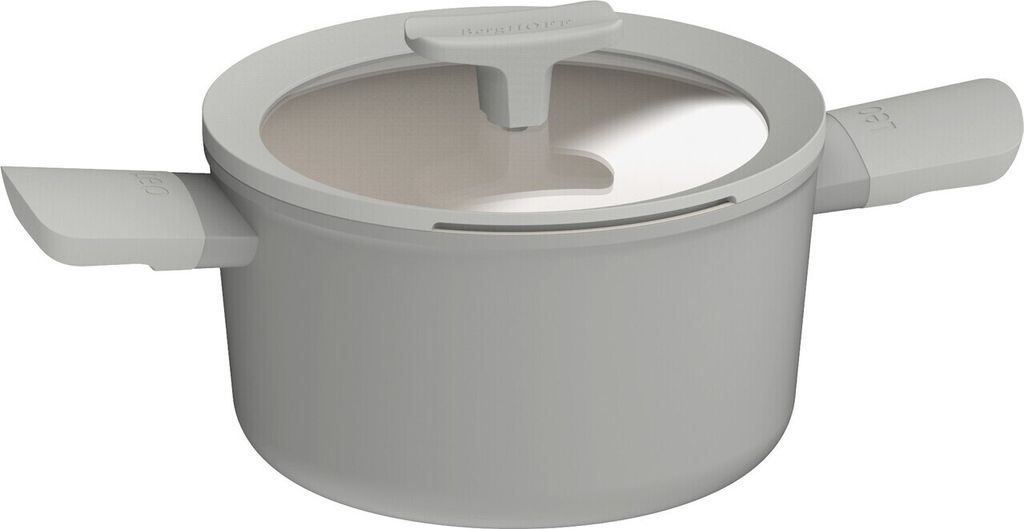 A studio shot of a gray pot with a glass lid and white handles.