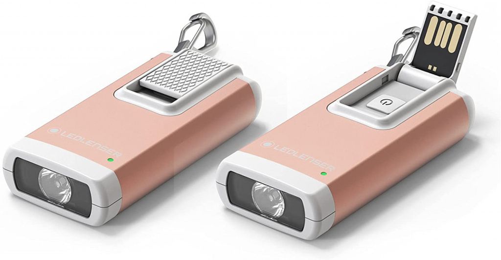 Two views of a small, rose gold colored flashlight with a USB connector.
