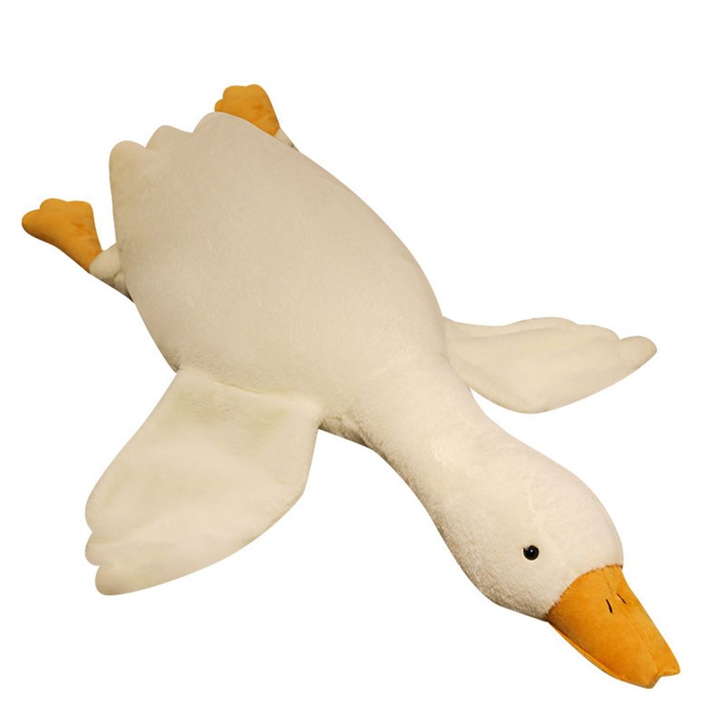 A plush toy goose lying on a white background.