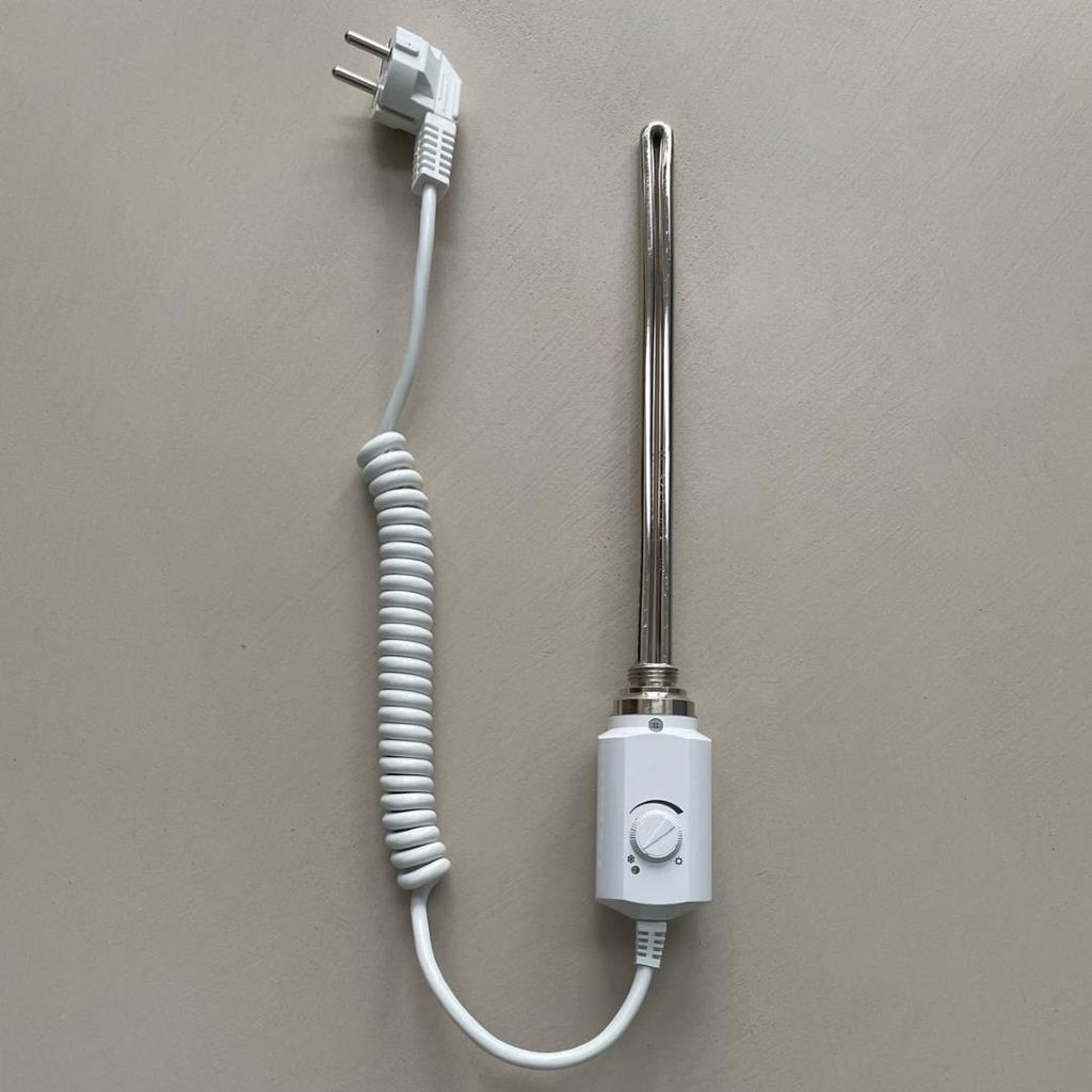 A white electric heating element with a coiled cord and a white plug is placed on a light gray background.