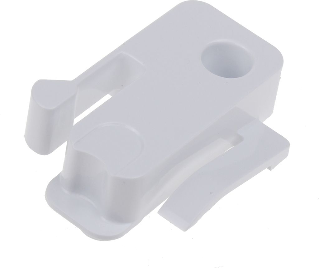 A white plastic stopper for a freezer compartment flap.