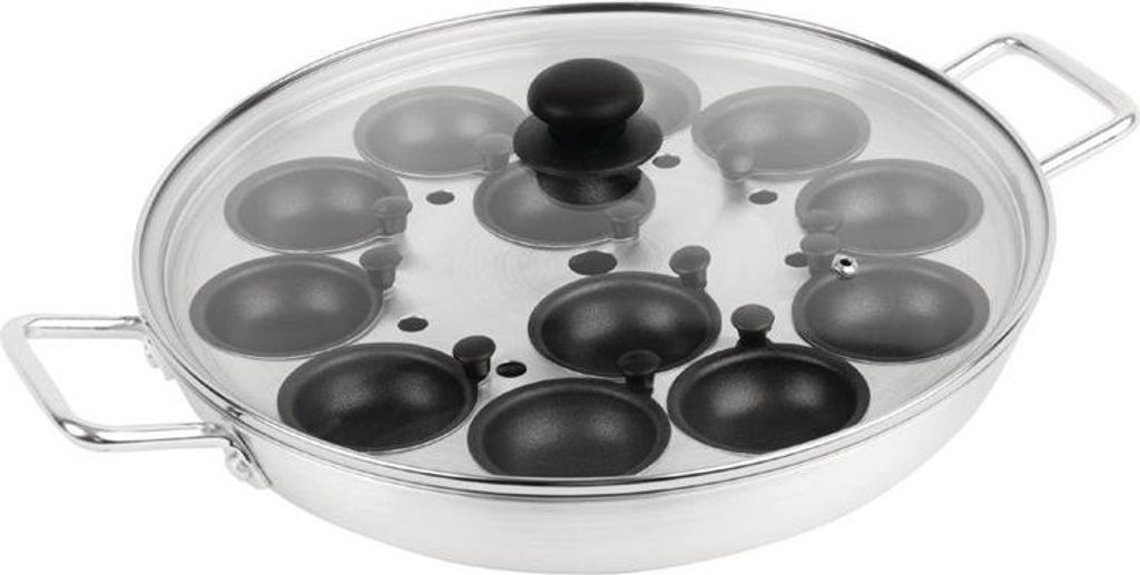 A close-up, studio shot of a stainless steel egg poacher with a glass lid.