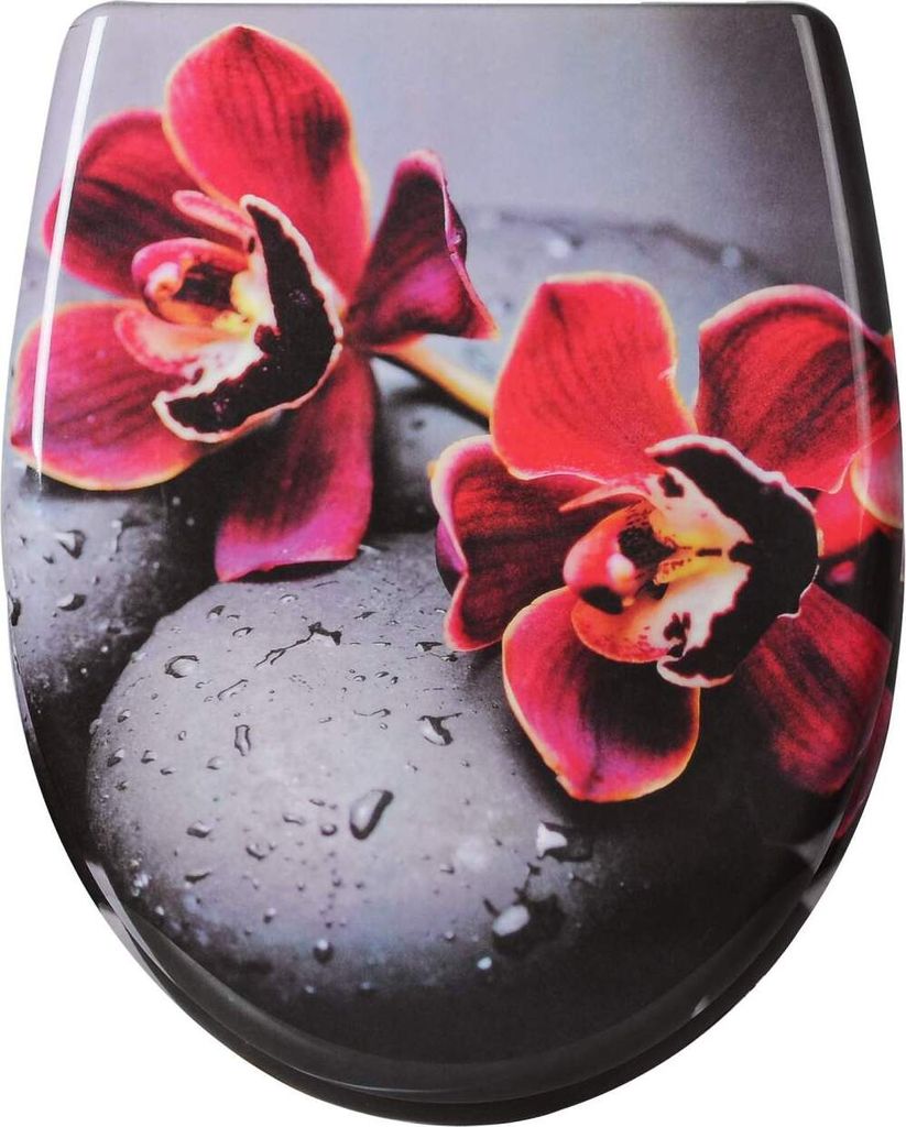 A close-up of a toilet seat with a floral and stone design.