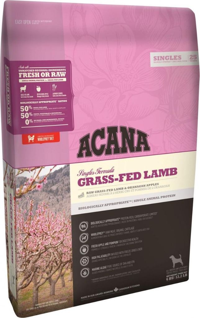 A bag of dog food with a picture of a flowering tree and mountains on it.