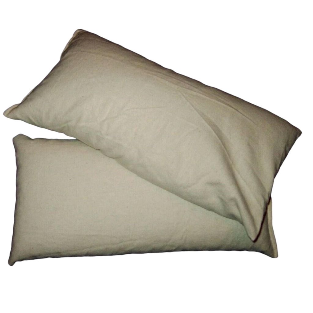 Two beige pillows are stacked on a white background.