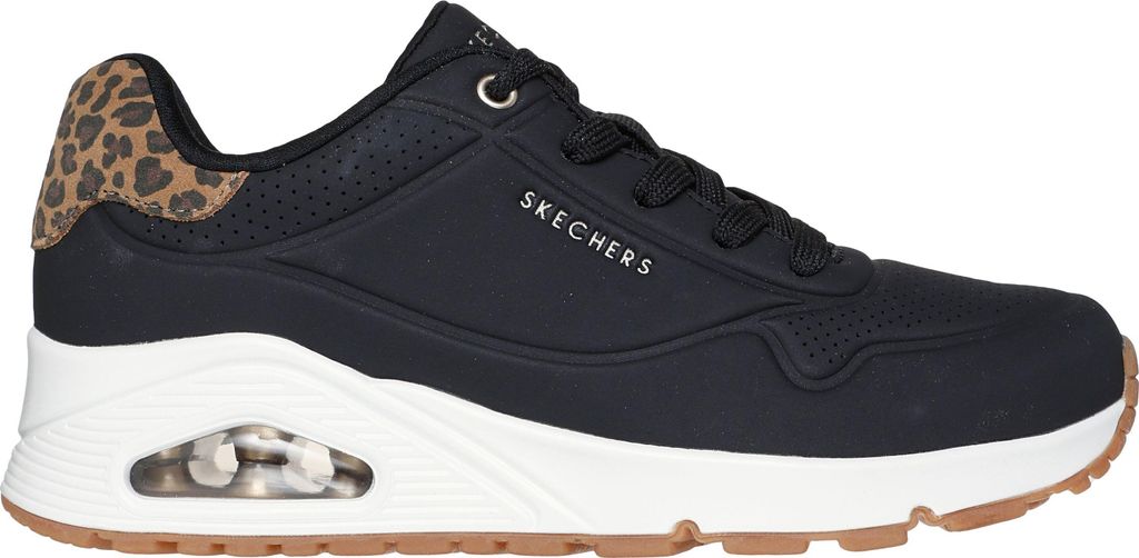 A side view of a black Skechers sneaker with leopard print accents.