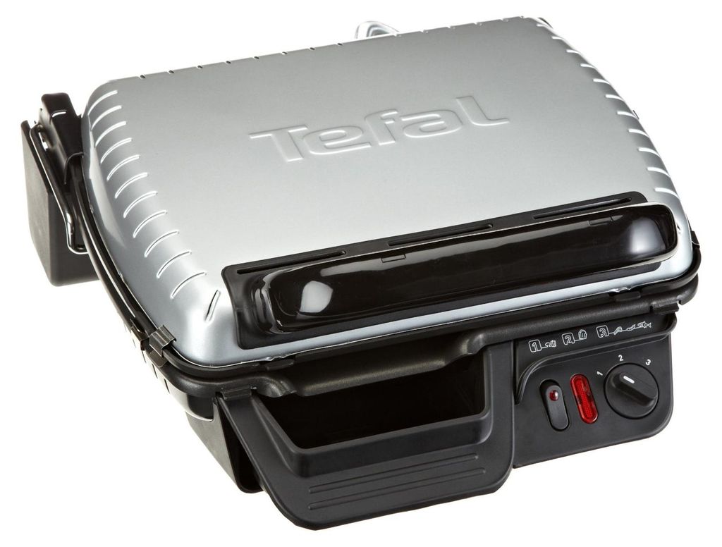A close-up, angled view of a silver and black Tefal contact grill.