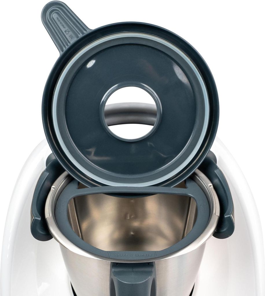 A close-up view of the lid and inner bowl of a kitchen appliance.