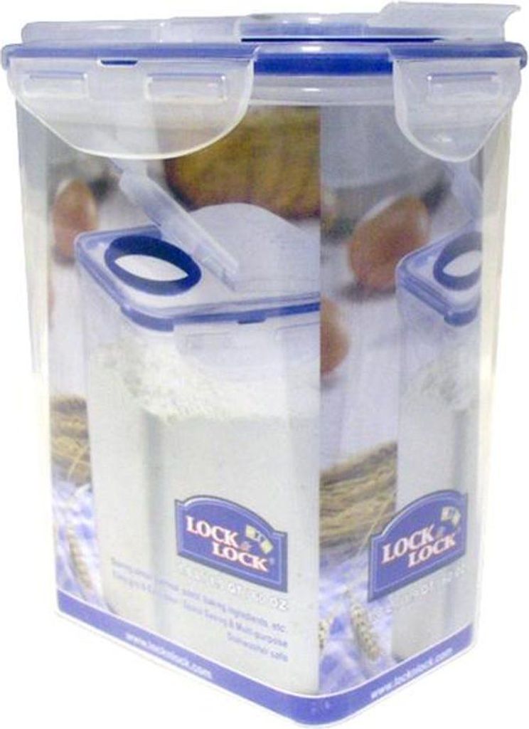 A clear plastic food storage container with a blue lid, filled with white powder, likely flour.