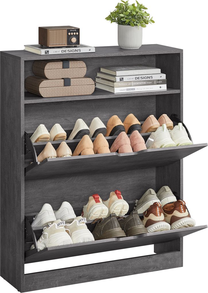 A grey shoe cabinet with multiple shelves and flip-down doors, filled with various shoes. A small plant sits on top of the cabinet.