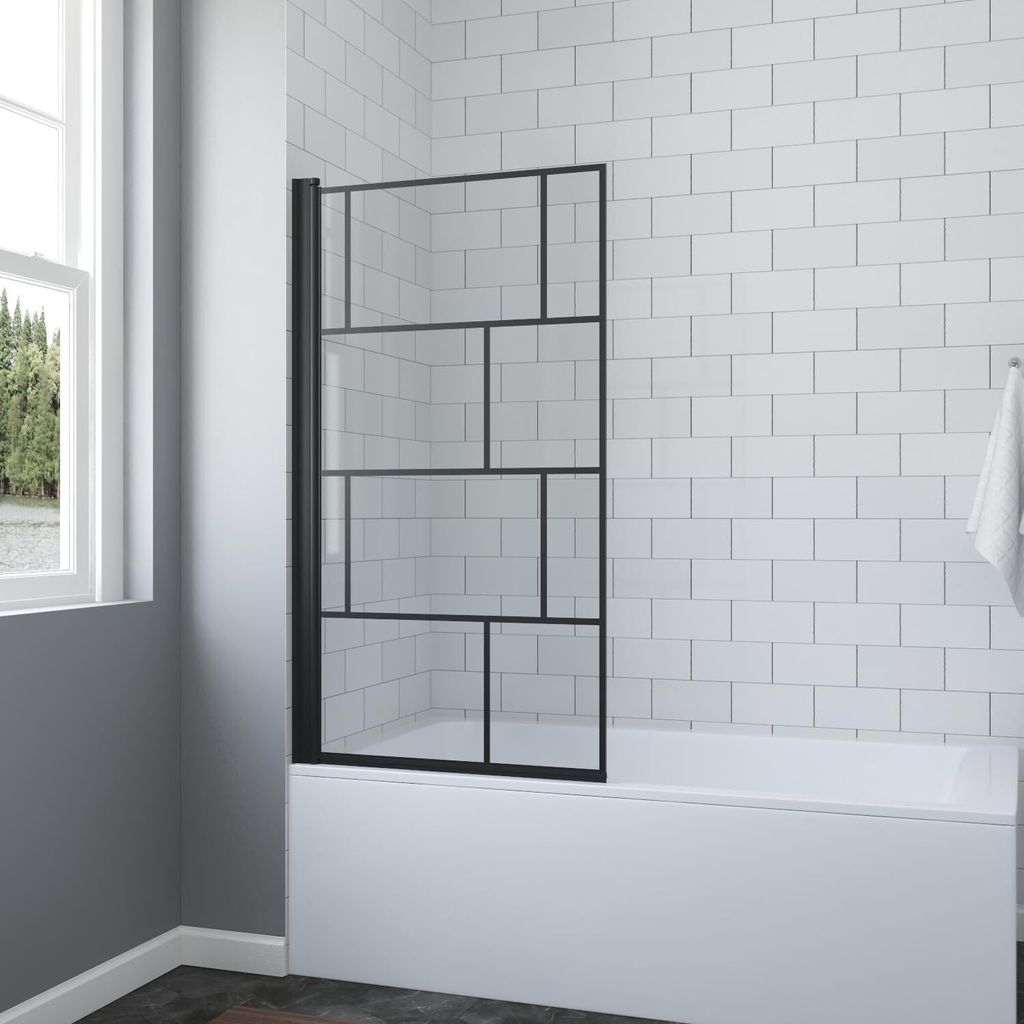 A shower screen for a bathtub in a bathroom with white tiled walls.