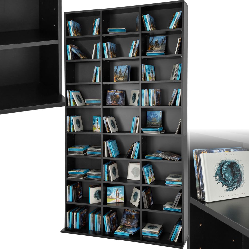A tall, black CD/DVD storage unit filled with various media cases.