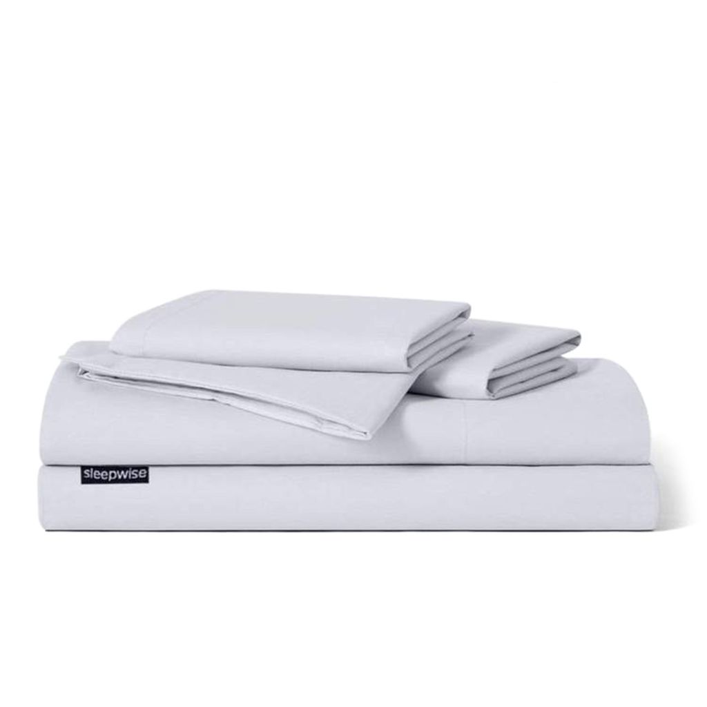 A stack of folded bedding on a white background.