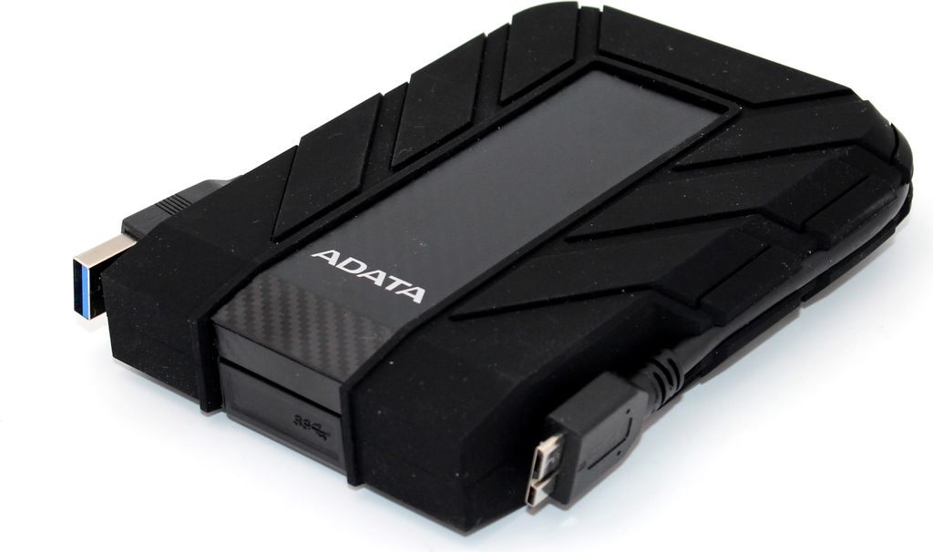 A black external hard drive with cables attached, shown from a diagonal angle on a white background.