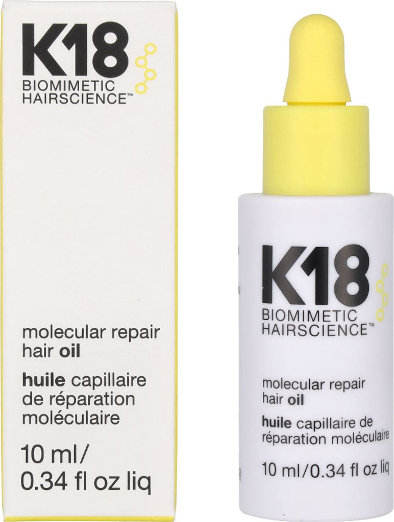 A product shot of K18 Molecular Repair Hair Oil, showing both the box and the bottle.