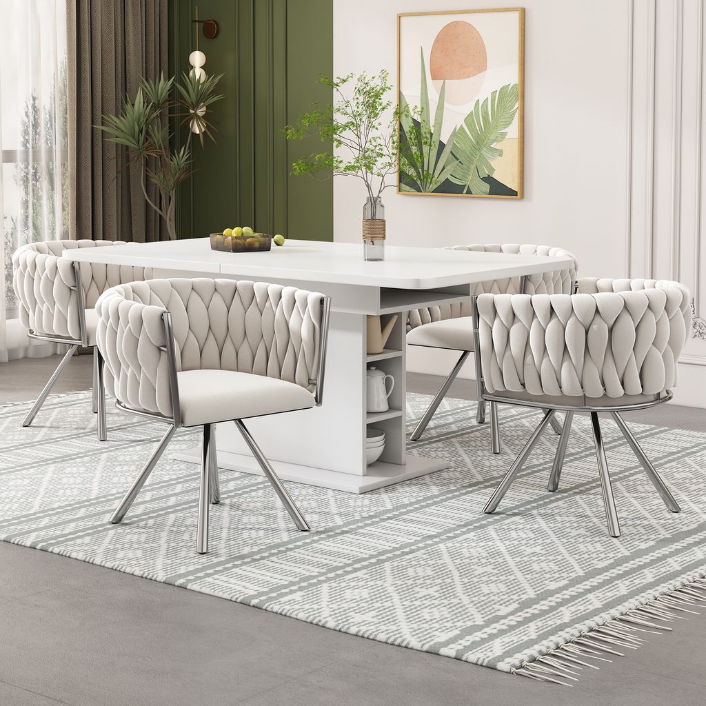 A dining room setting with a white table and chairs.