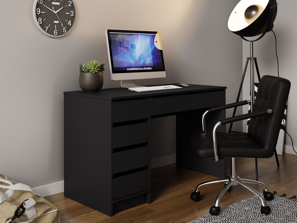 A modern black desk with a computer and chair in a room.