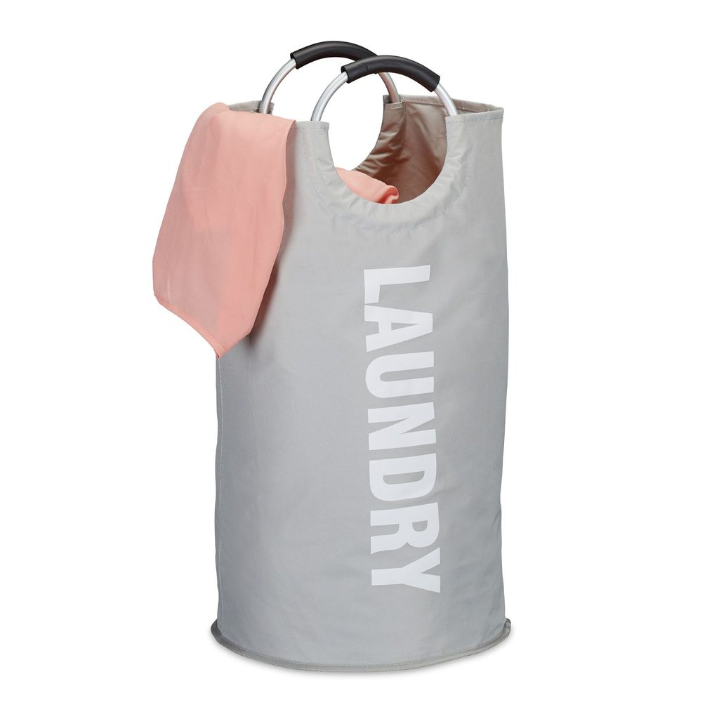 A gray laundry basket with pink fabric draped over the side, against a white background.