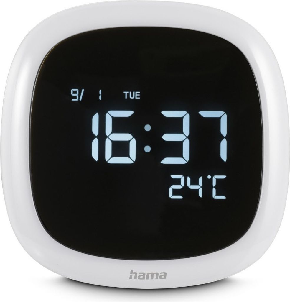 A white digital alarm clock with a black screen displaying the time, date, and temperature.