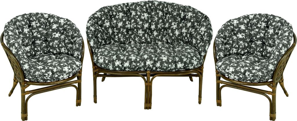 A set of rattan furniture with floral cushions, including a two-seater sofa and two armchairs, displayed against a white background.