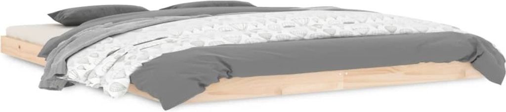 A low profile wooden bed frame with bedding.