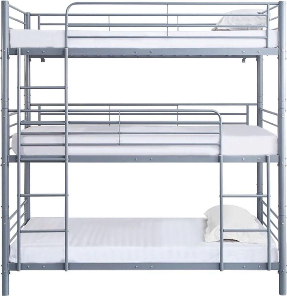 A triple bunk bed with mattresses.