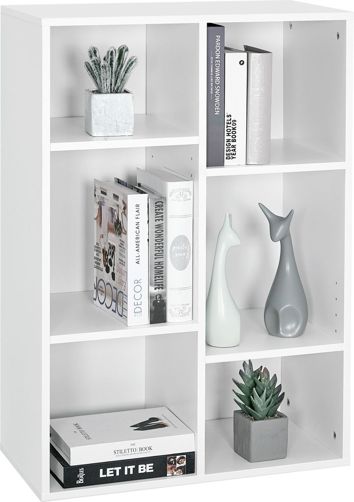 A white bookshelf filled with books and decorative items.