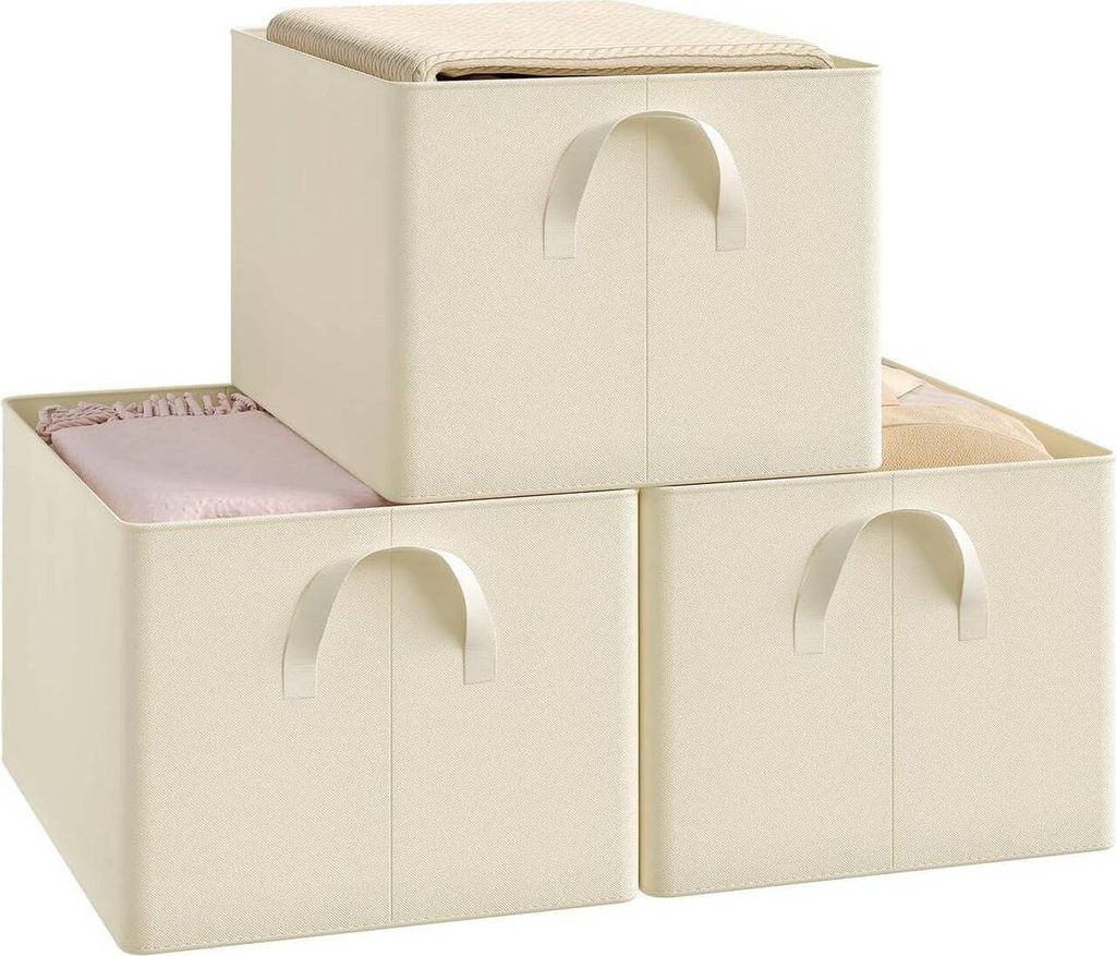 Three cream-colored storage boxes are stacked and arranged.