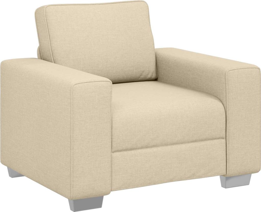 A studio shot of a single beige armchair.