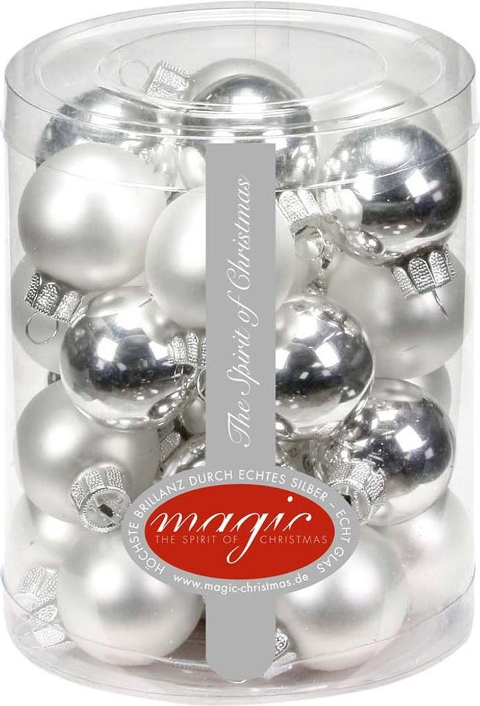 A clear plastic container filled with silver and white Christmas ornaments.