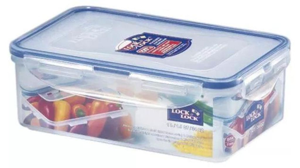 A clear plastic food storage container with a blue lid, filled with colorful vegetables.