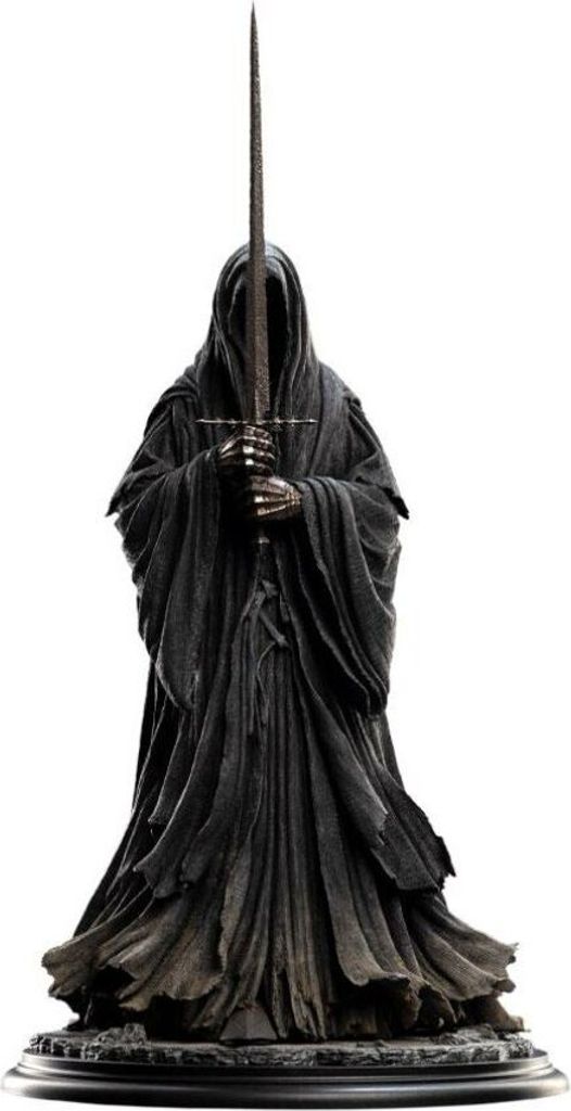 A statue of a Ringwraith from Lord of the Rings, holding a sword.
