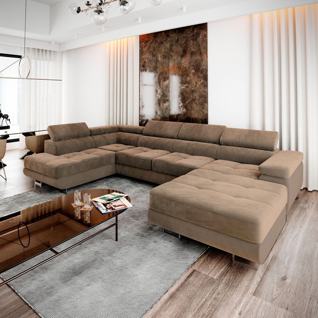 A modern living room with a large sectional sofa, coffee table, and abstract art on the wall.