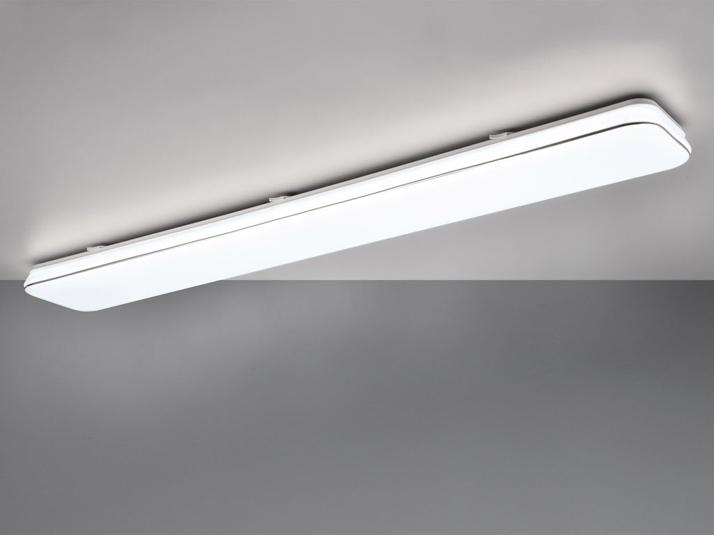 A white LED ceiling light fixture mounted on a white ceiling, with a gray background below.