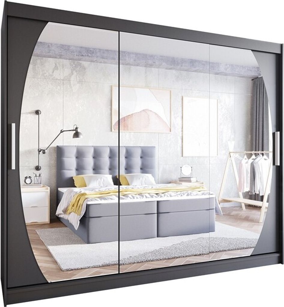 A bedroom scene reflected in a mirrored wardrobe.