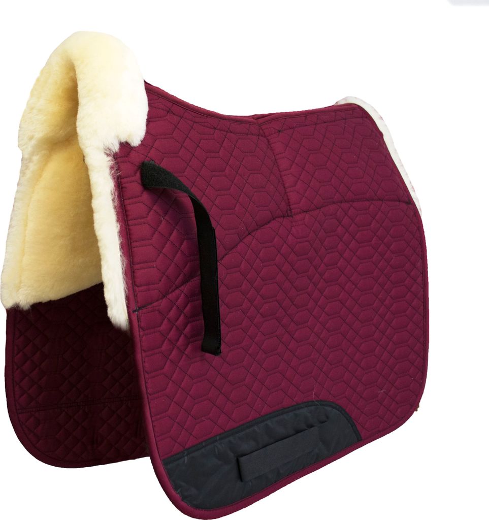 A burgundy saddle pad with cream-colored sheepskin lining and black accents, shown against a white background.