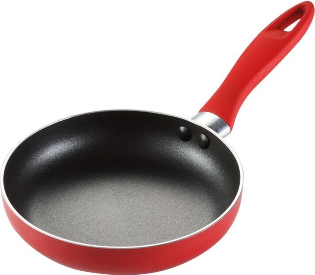 A red and black frying pan with a red handle is shown against a white background.