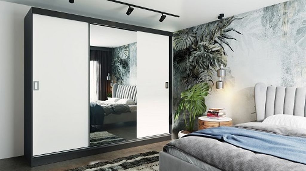 A bedroom scene featuring a large sliding door wardrobe with mirrored doors, a bed with a plush headboard, and a tropical-themed wallpaper.